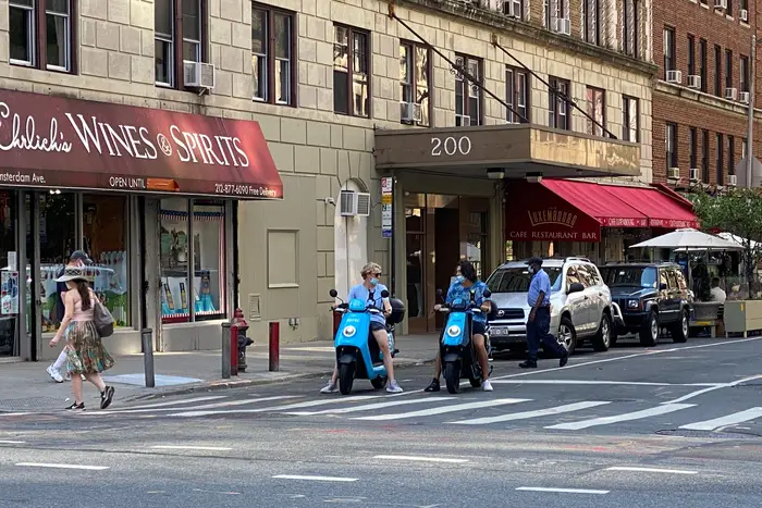 Two Revel riders on the Upper West Side on July 26th, 2020.